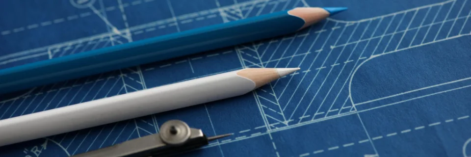 Pencils laying on a blueprint