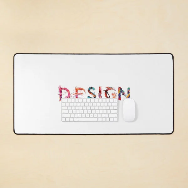 A desk mat with the word "Design" in paint on a white background.