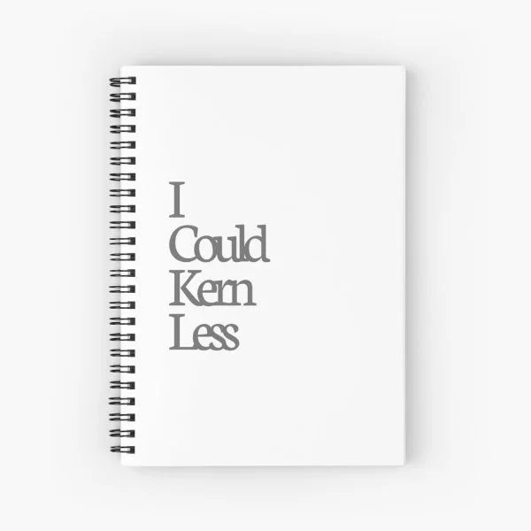 A spiral notebook with the phrase "I could kern less".