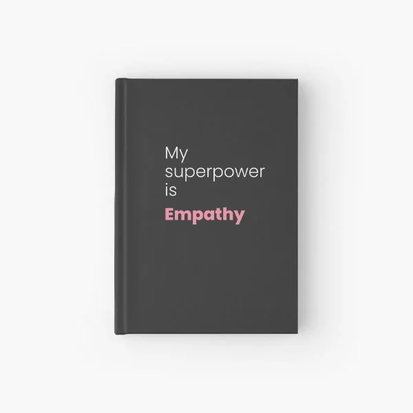 A hardcover journal with the phrase "My superpower is empathy" in white and pink letters.
