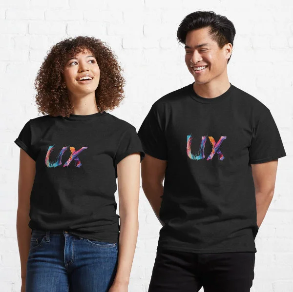 A woman and man wearing dark T-Shirts with the letters "UX" painted on them.