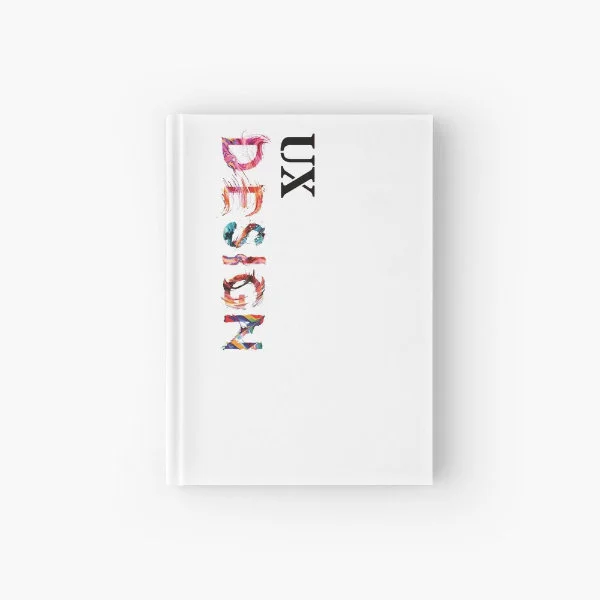 A hardcover journal with the words "UX Design" in paint.