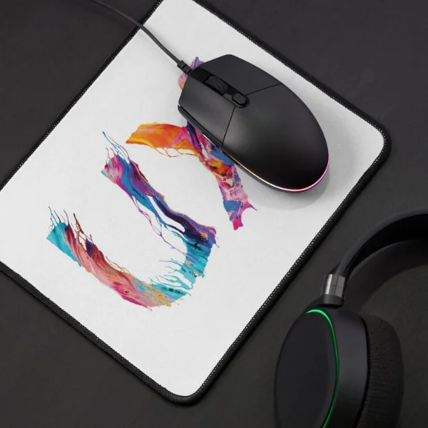A mouse pad with the letters "UX" in paint.